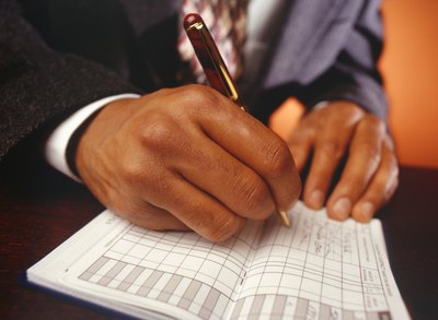 Business executive recording check payments