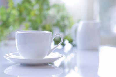 Coffee cup on table.