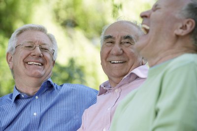 men laughing 50th high school reunion
