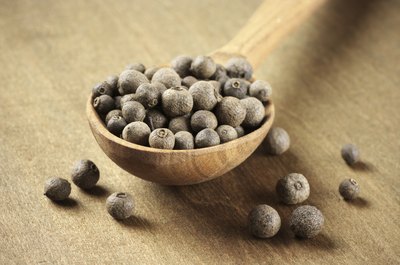 Spoonful of allspice peppercorns.