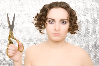 Woman with scissors to cut hair.