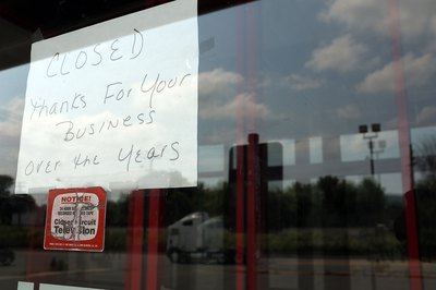 Sign on window of closed video store in New York