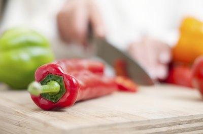 Chef dicing peppers
