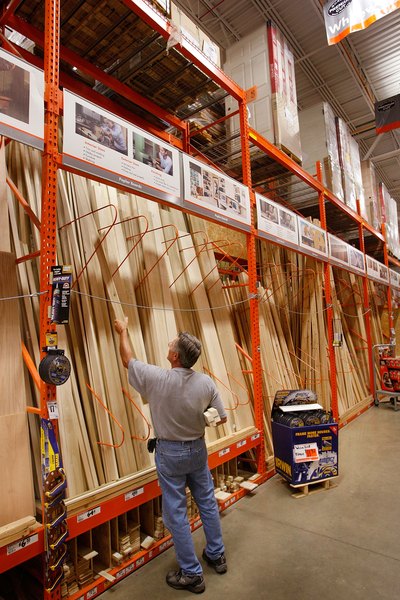 Man selects wood for home project