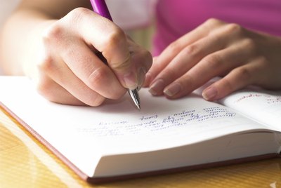 Woman writing in journal
