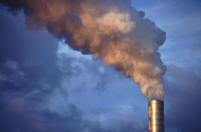 smog being released from factory into the air
