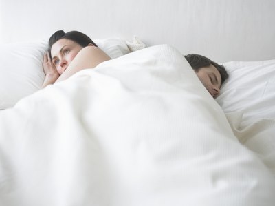 Woman awake in bed