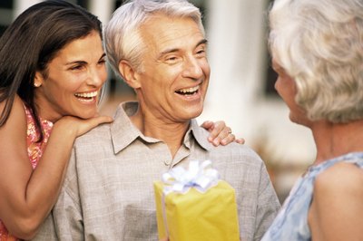 Giving gifts to elderly men.