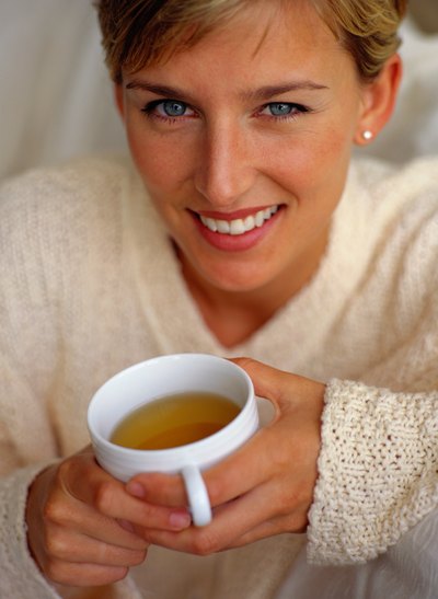 Woman drinking hot tea