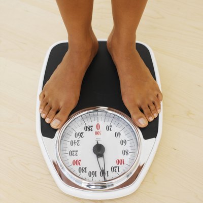 Woman weighing herself