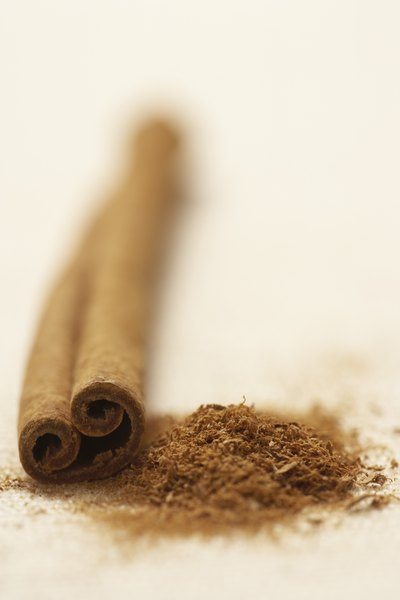 Cinnamon sticks are ground into cinnamon flakes to create tea.