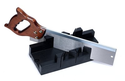 A corner miter box holds the material steady.