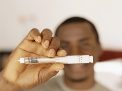 Man holding insulin pen