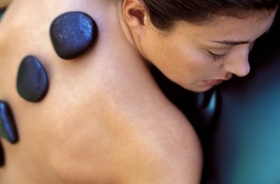Woman getting stone massage