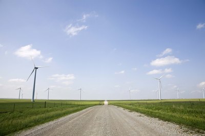 A close-up of a road on a wind turbine farm.