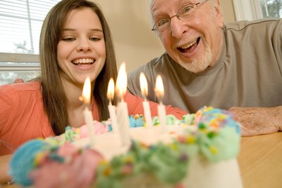 Man celebrating birthday with granddaughter
