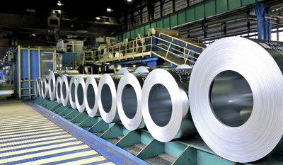Rolls of steel sheeting inside a factory