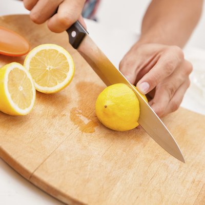 Close-up of lemons being sliced.