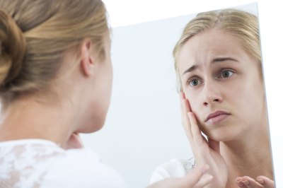 girl looking at skin