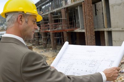 Foreman looking at blueprints