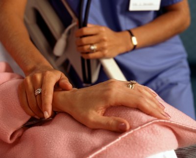 Doctor holding patients hand