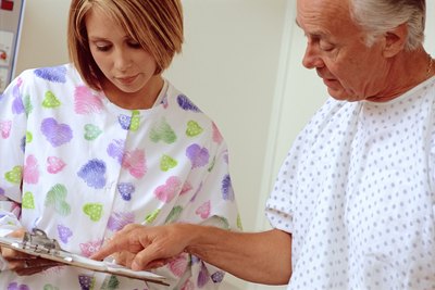 Senior man talking with nurse