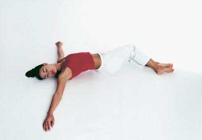 Drop both knees to one side and gaze over the opposite shoulder.