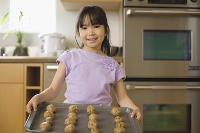 little girl baking cookies