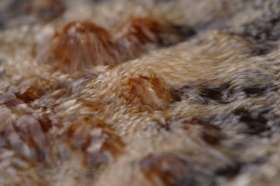 Closeup of boiling grease being distilled