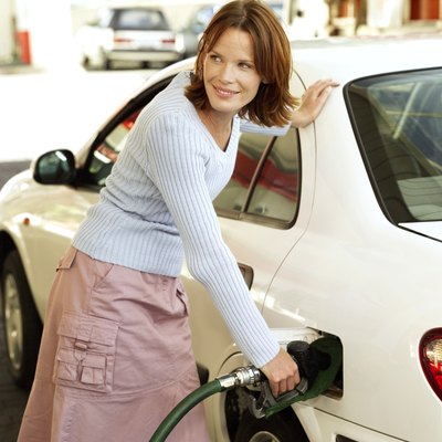 Filling her tank with a gas gift card for a road trip.