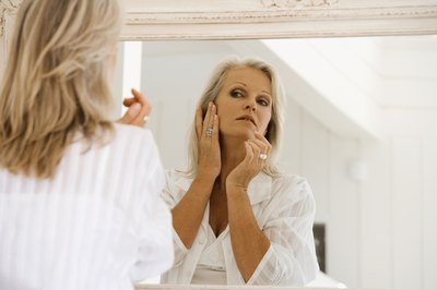 Woman checking her complexion