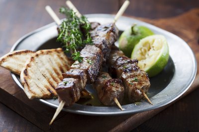 Beef skewers on a plate.