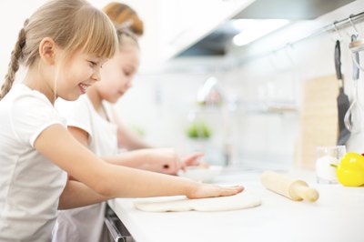 Girls making a pizza
