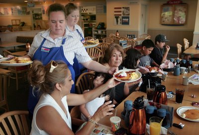 Waitress serving guests