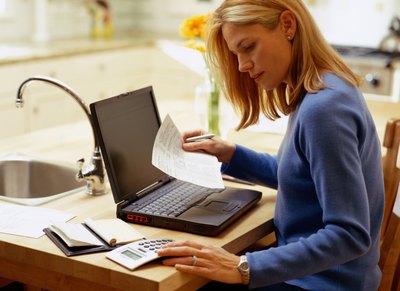 Woman calculating expenses