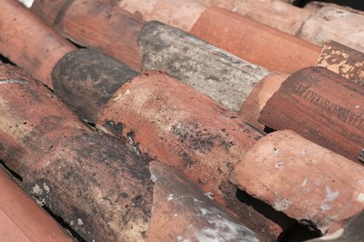 Clay tiles are made from earth that is baked in a kiln to remove moisture
