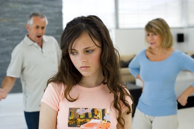 Sad teen with angry parents