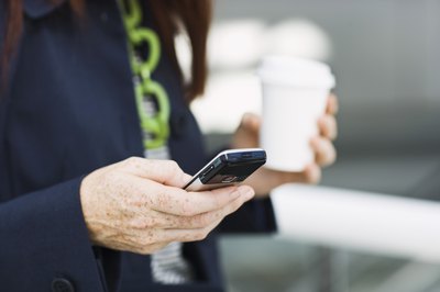 Woman holding coffee cup