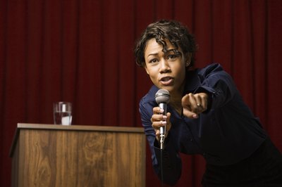 Woman calling audience member on stage