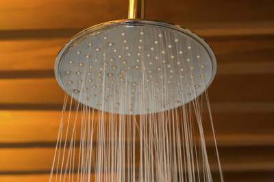 Standard height for a shower head is 61 inches from the floor.