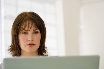 Woman reading on laptop