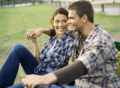 Couple holding hands on farm