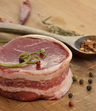 Bacon strips should be as wide as the filet thickness to allow even cooking.