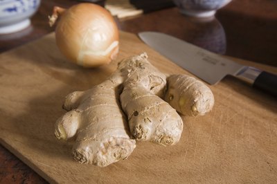A Ginger root on a cutting board.