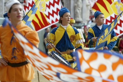 Standard bearers in traditional medieval costumes in Siena, Italy