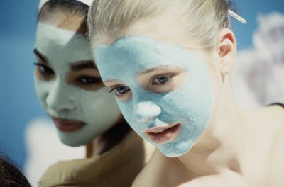 Two girls wearing facial masks.