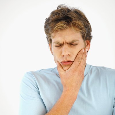 Young man with a tooth infection.