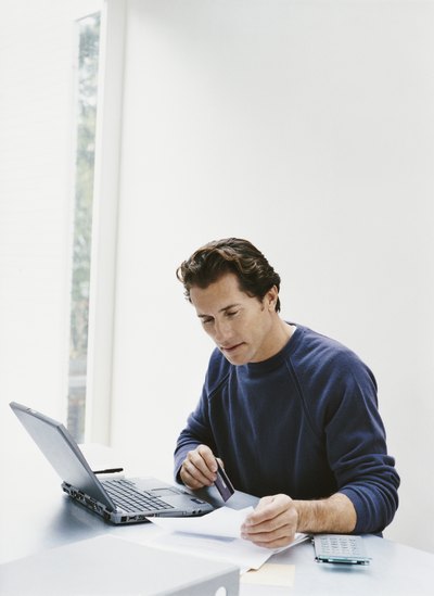 Man paying credit card bill