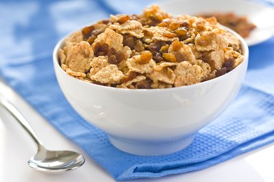 Small bowl of cereal on table.