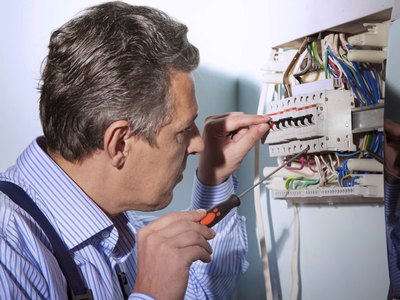Open the main breaker and the backfeed breaker.